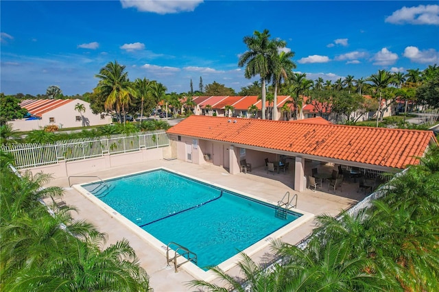 view of swimming pool featuring a patio area