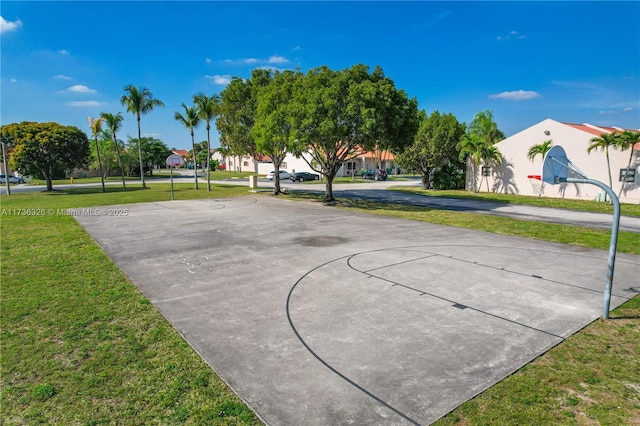 view of sport court featuring a yard