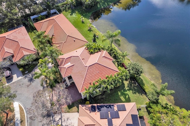 birds eye view of property with a water view