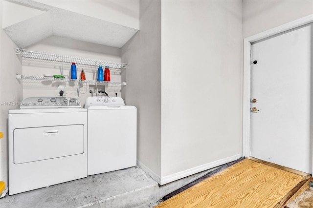 laundry area with washing machine and dryer