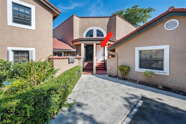 entrance to property featuring a patio