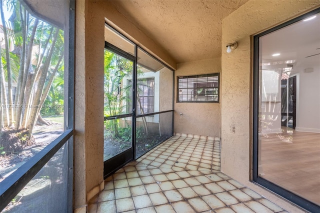 unfurnished sunroom with a wealth of natural light