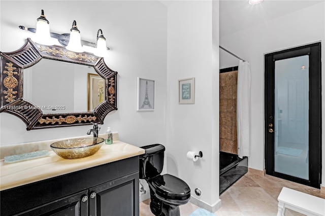 bathroom with walk in shower, vanity, and toilet