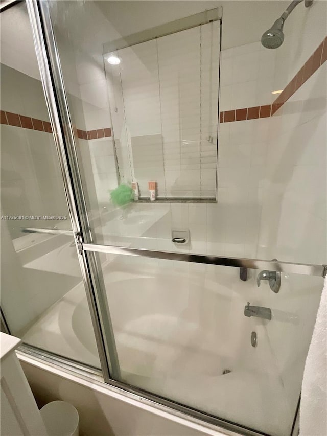 bathroom featuring enclosed tub / shower combo