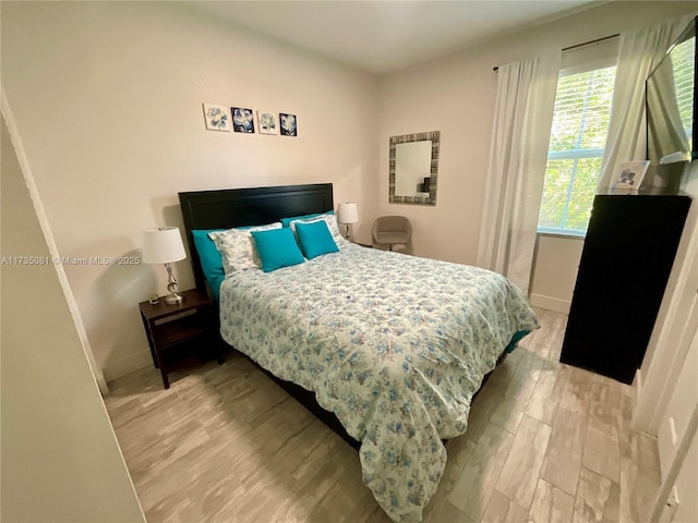 bedroom with wood-type flooring