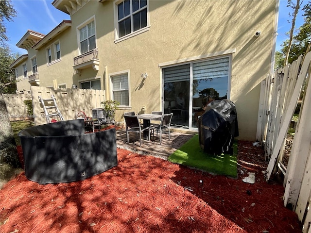 view of patio with cooling unit and grilling area