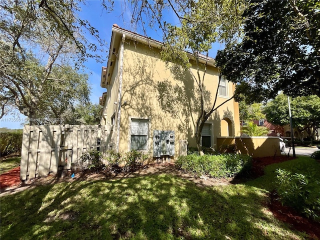 rear view of property with a yard