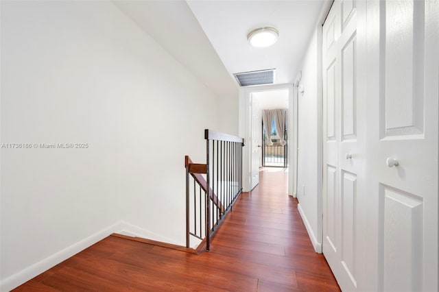 hall featuring dark wood-type flooring