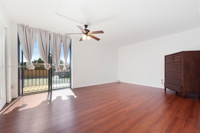 empty room featuring dark hardwood / wood-style floors and ceiling fan