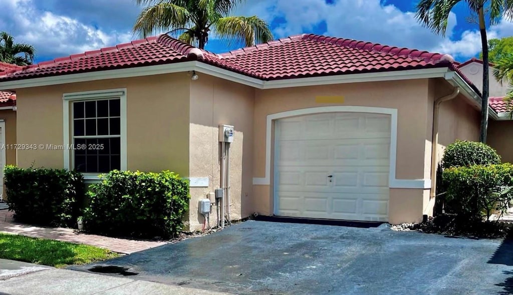 view of front of property with a garage