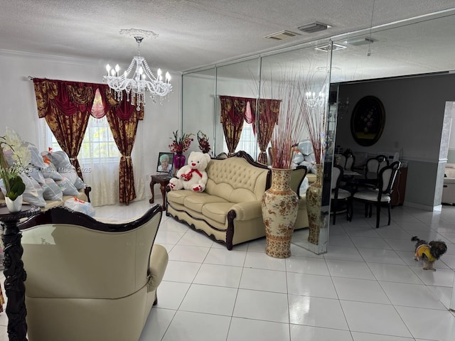 living room featuring an inviting chandelier, ornamental molding, a textured ceiling, and light tile patterned floors