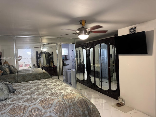bedroom with light tile patterned flooring and ceiling fan