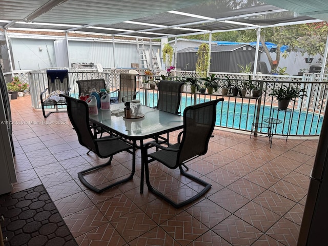 view of patio / terrace with glass enclosure