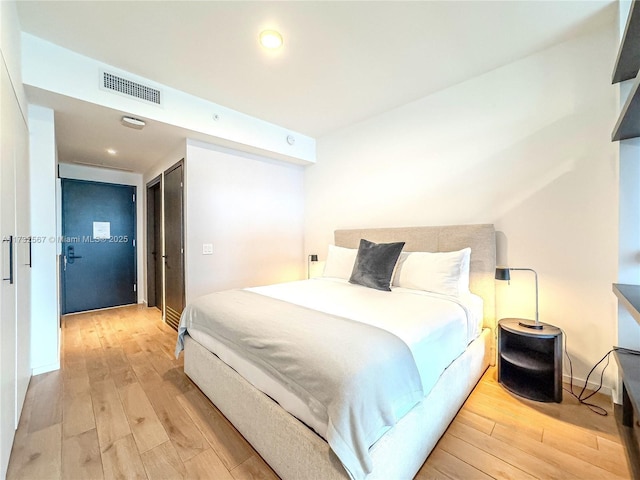 bedroom featuring light wood-type flooring