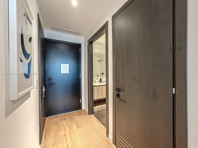 hallway featuring light hardwood / wood-style floors