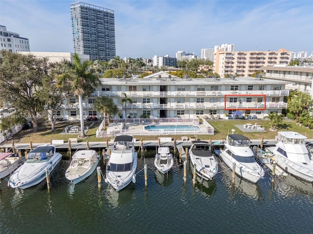 dock area with a water view and a view of city