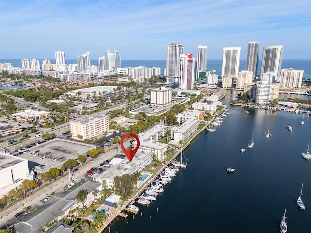 drone / aerial view featuring a water view and a city view