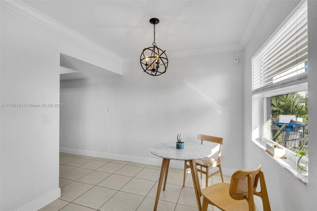 dining space with a water view, crown molding, a chandelier, and light tile patterned floors