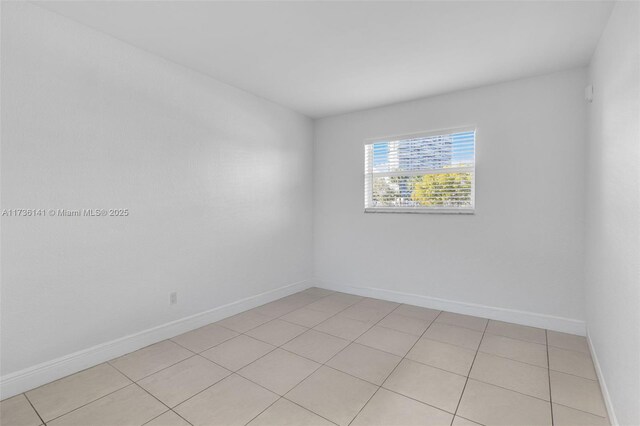 bedroom with light tile patterned floors