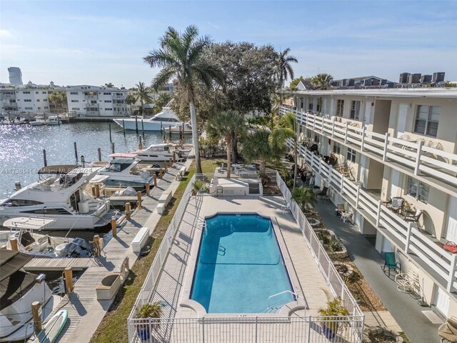 dock area featuring a yard and a water view