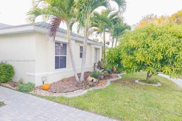 view of side of home featuring a lawn