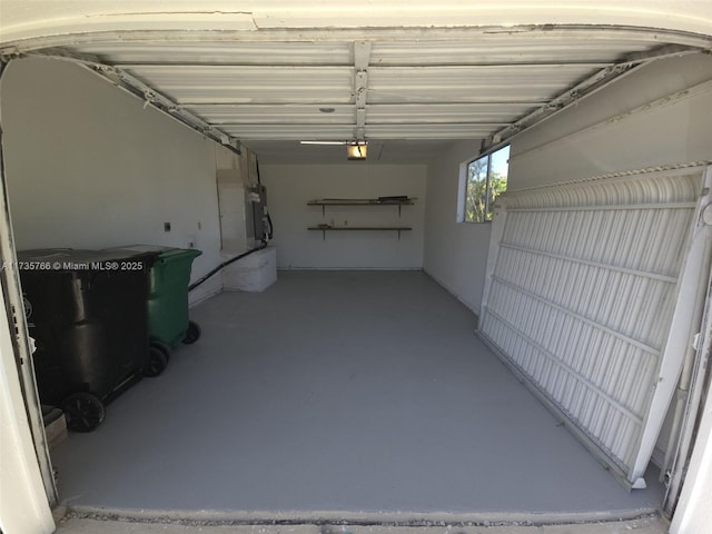 garage with a garage door opener and water heater