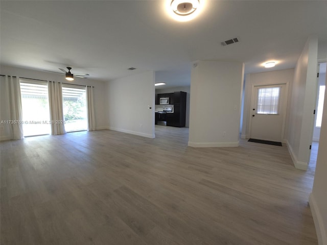 interior space featuring wood-type flooring and ceiling fan