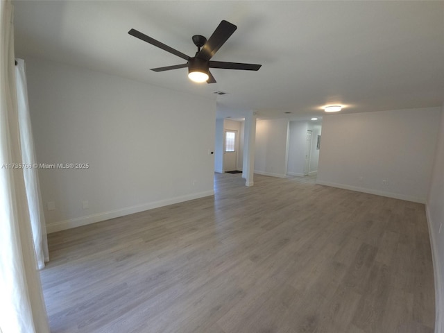 unfurnished room with ceiling fan and light wood-type flooring