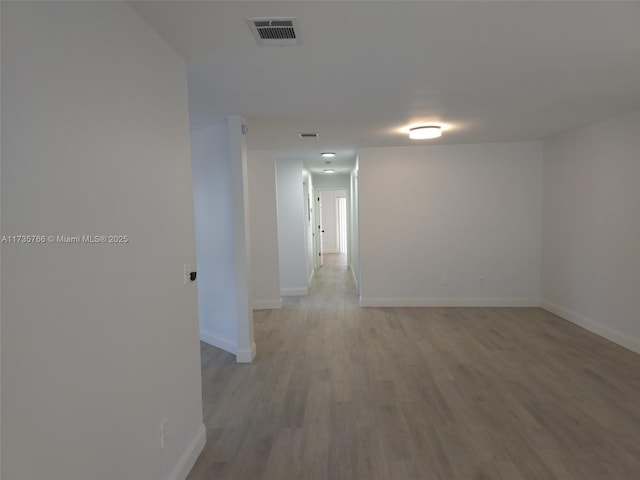 hallway featuring hardwood / wood-style floors