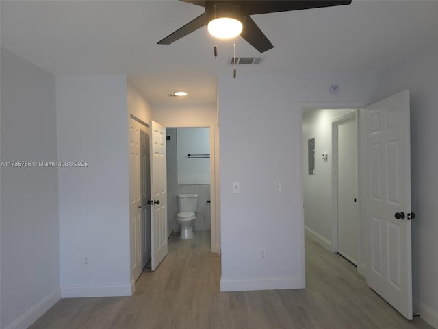 hall with light hardwood / wood-style floors