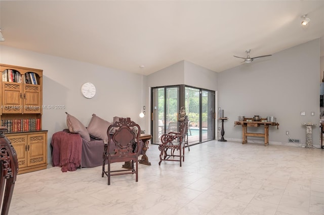 interior space featuring vaulted ceiling and ceiling fan