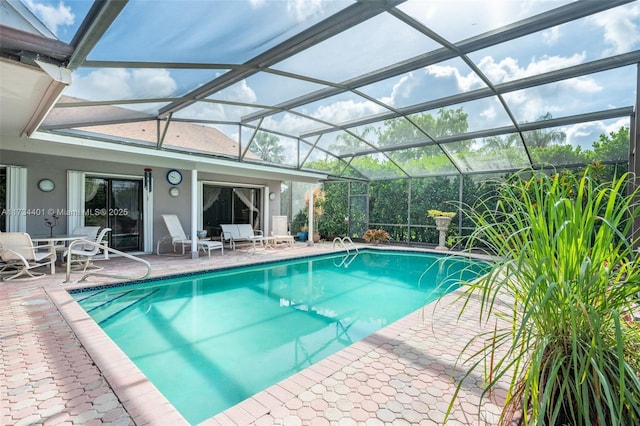 view of pool featuring a lanai and a patio