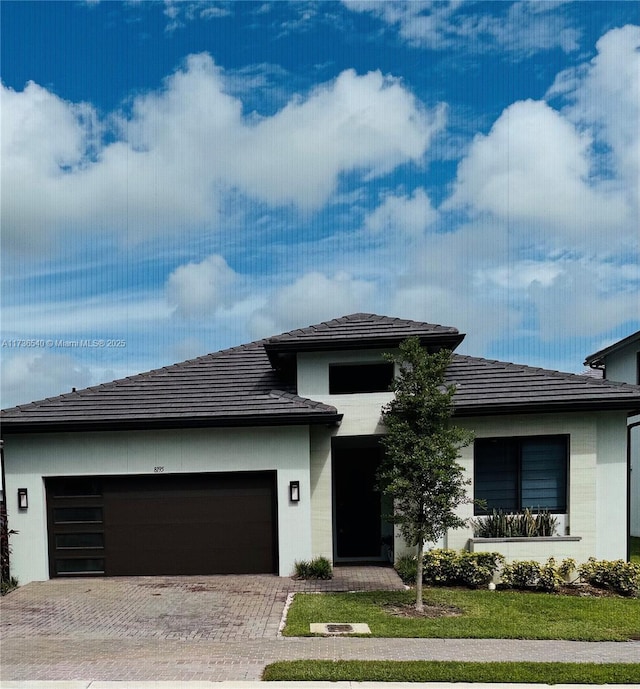 prairie-style home featuring a garage