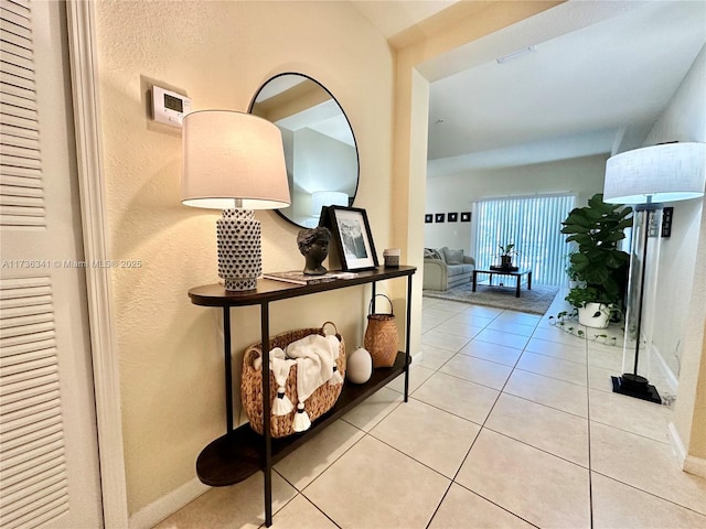 hallway with light tile patterned floors