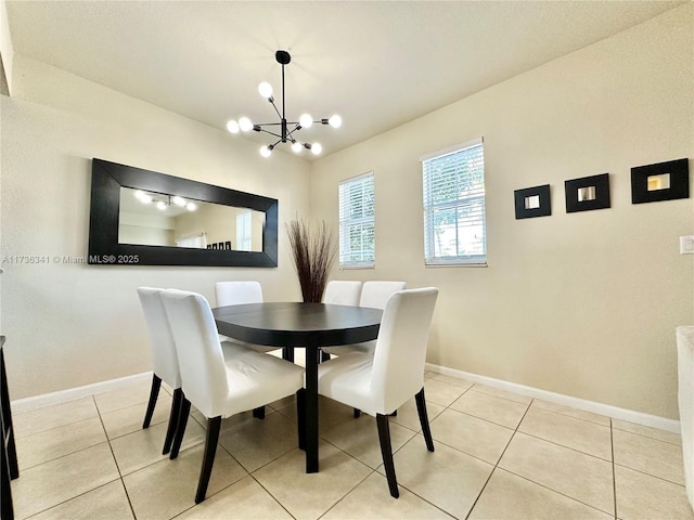 dining area with a chandelier and light tile patterned floors