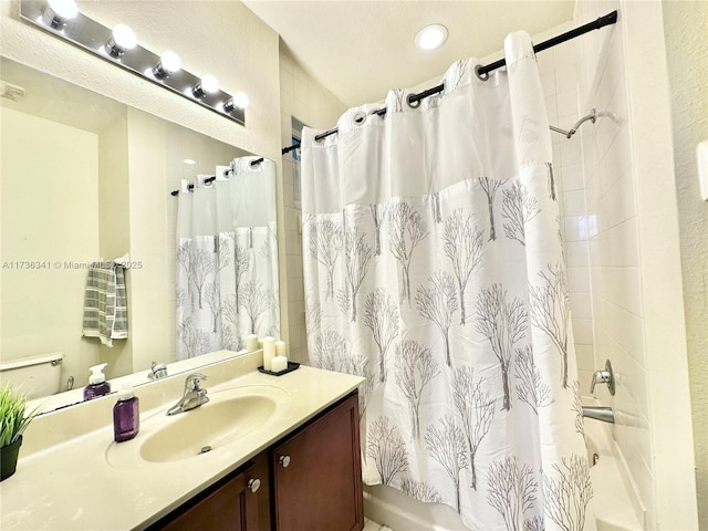 bathroom with vanity and shower / bath combo