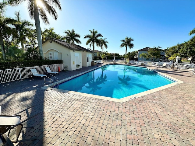 view of swimming pool featuring a patio area