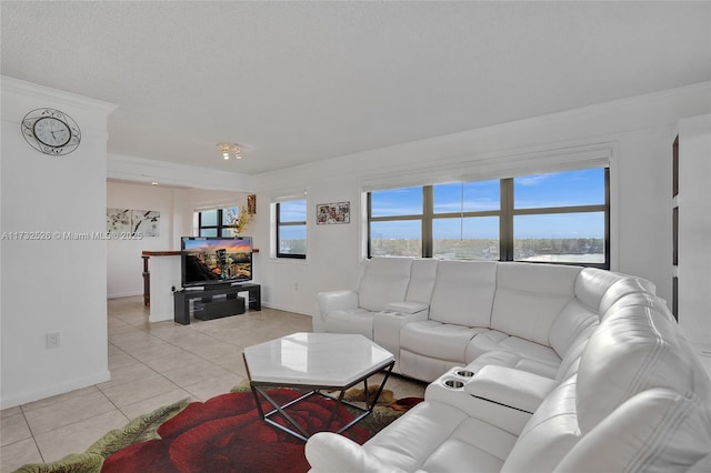 living room featuring light tile patterned floors and baseboards