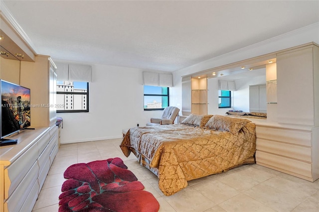 bedroom with light tile patterned floors and crown molding