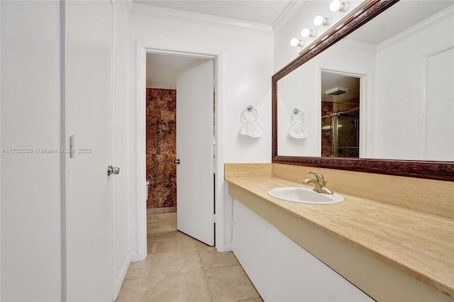 bathroom with vanity, ornamental molding, and tile patterned floors