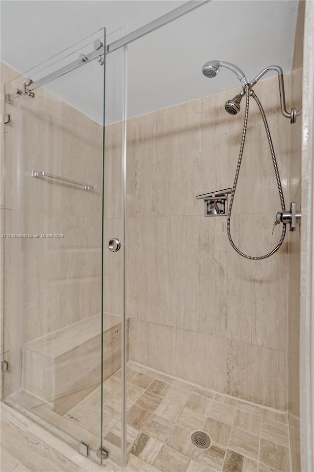 full bathroom featuring a shower stall