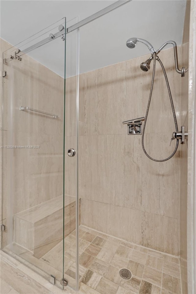 bathroom featuring tiled shower