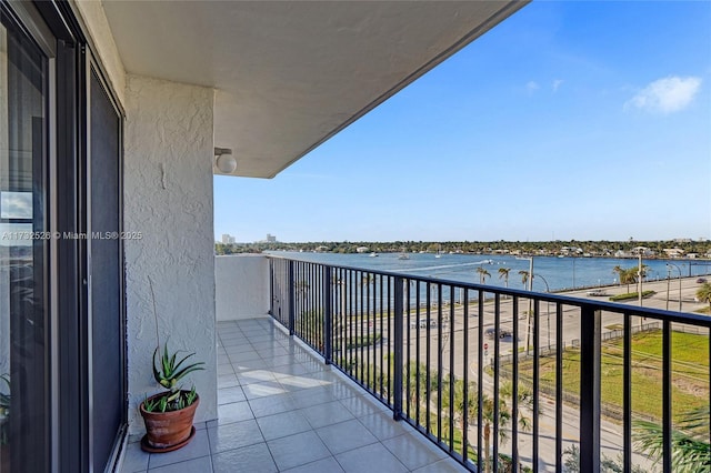 balcony featuring a water view