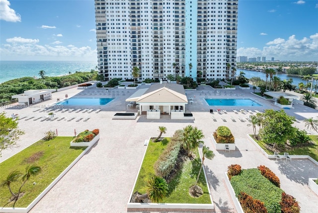 birds eye view of property with a water view