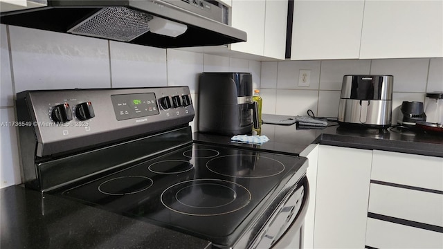 kitchen with white cabinetry, stainless steel electric range oven, extractor fan, and decorative backsplash