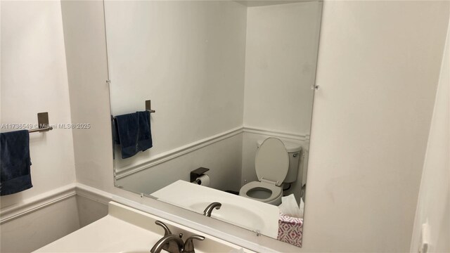 bathroom featuring sink and toilet