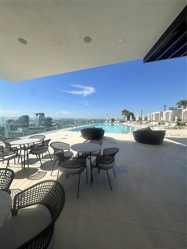 view of patio featuring a community pool