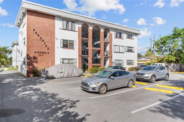 view of property with uncovered parking