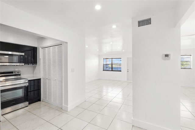 kitchen featuring visible vents, light tile patterned flooring, stainless steel appliances, light countertops, and recessed lighting