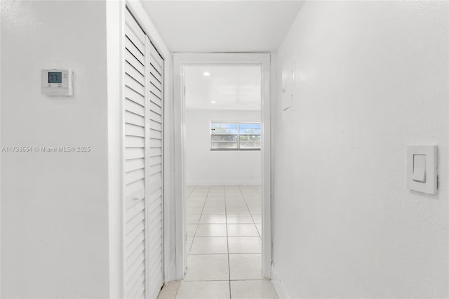 hall featuring light tile patterned floors